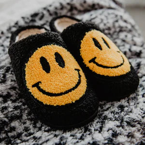 BLACK FUZZY HAPPY FACE SLIPPERS